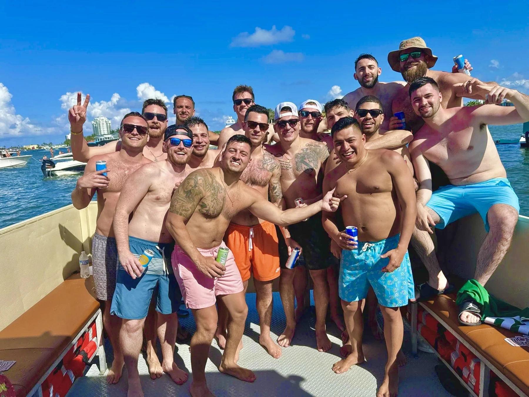 Bachelor party group posing together on the sunny Freaky Tiki deck at the Fort Lauderdale sandbar