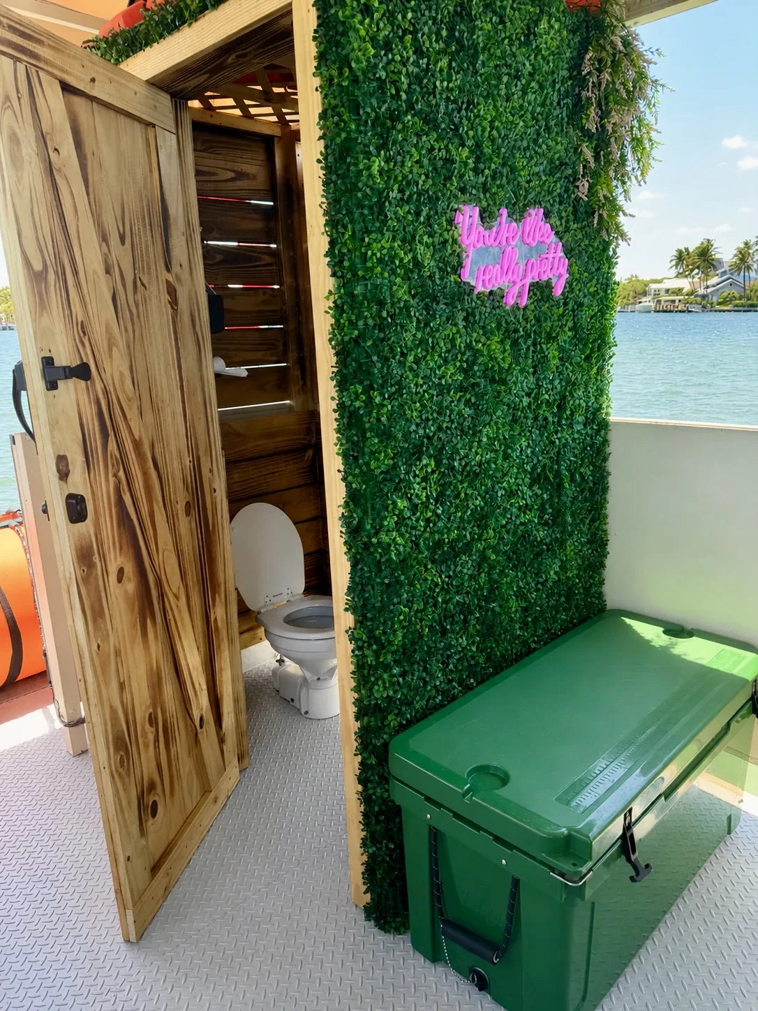 Private onboard restroom, cooler and nonslip deck aboard Freaky Tiki Boat Charters in Fort Lauderdale